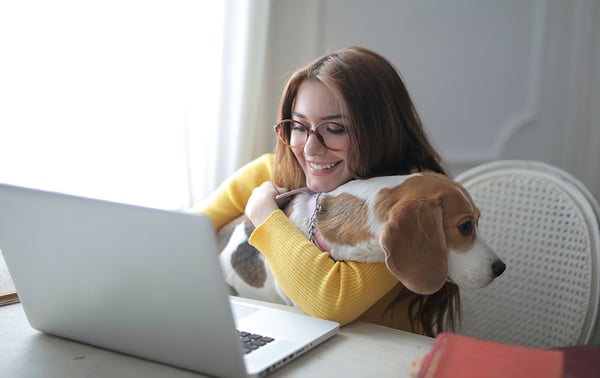 girl working from home with a dog